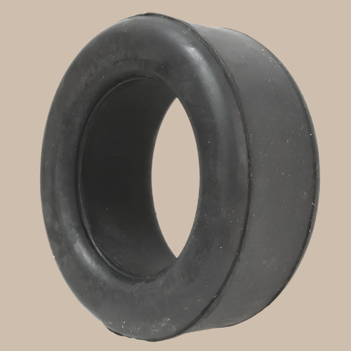 Black rubber bushing on a beige background