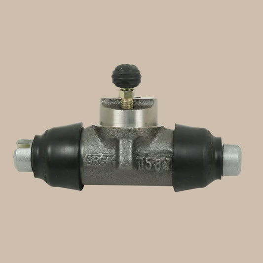 Rear brake cylinder with black and silver components on a beige background