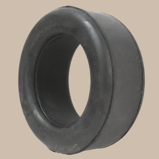 Black rubber bushing on a beige background