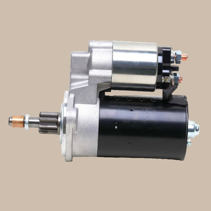 Car starter motor on a beige background